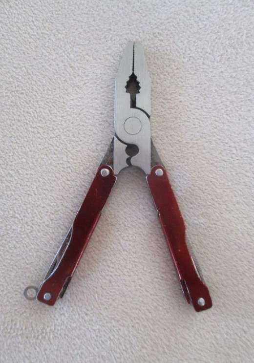 Small vintage Victorinox Swiss Army Knife plus other small fold-up tool gadget