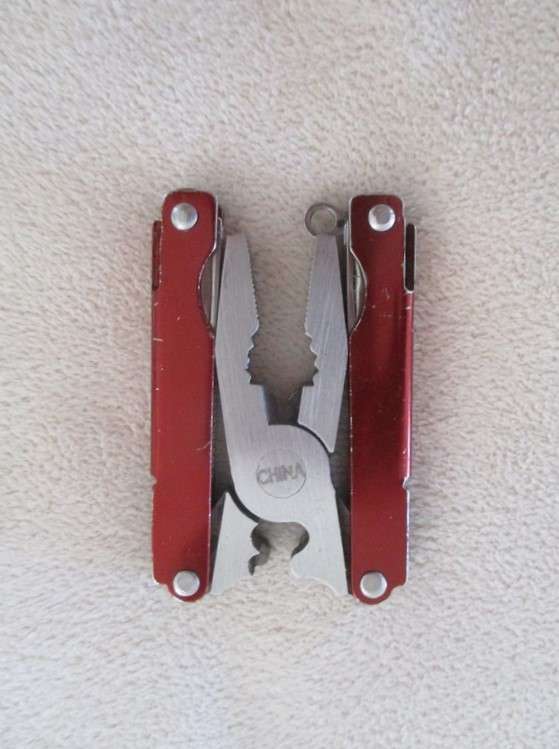 Small vintage Victorinox Swiss Army Knife plus other small fold-up tool gadget