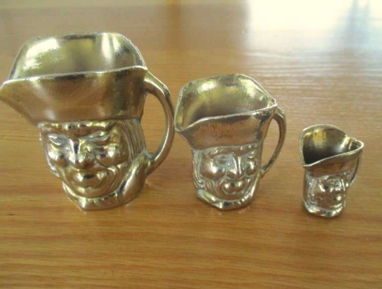 Three cute miniature brass Toby jugs