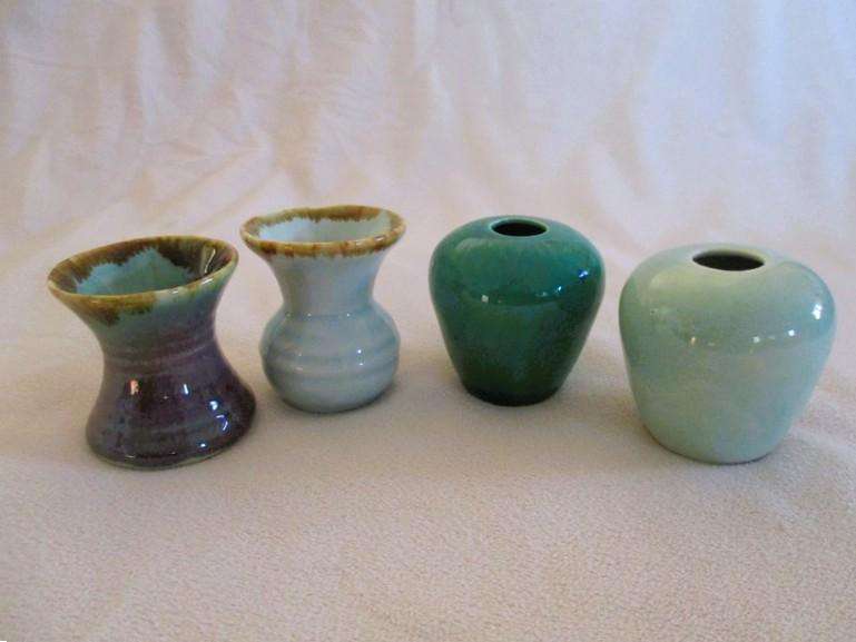 Four beautiful glazed ceramic small vases for single-flower displays