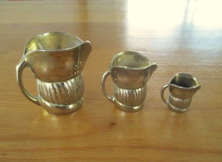 Three cute miniature brass Toby jugs