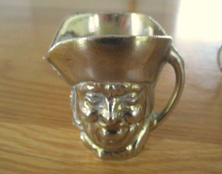 Three cute miniature brass Toby jugs