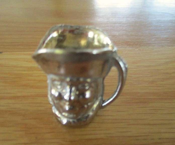 Three cute miniature brass Toby jugs