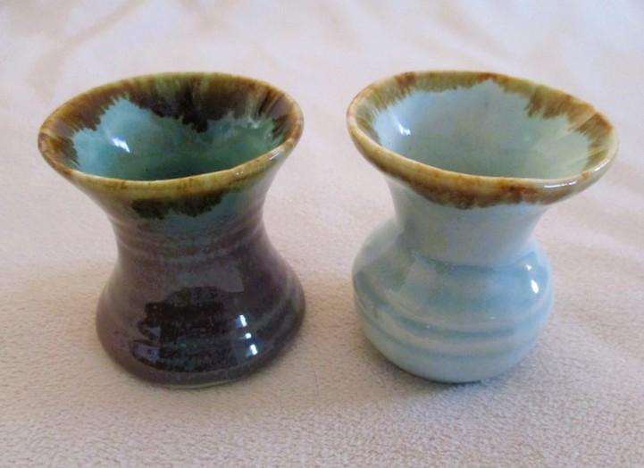 Four beautiful glazed ceramic small vases for single-flower displays