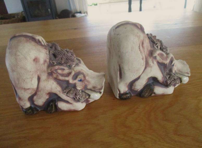 So original! a pair of large ceramic warthog bookends