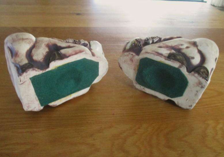 So original! a pair of large ceramic warthog bookends