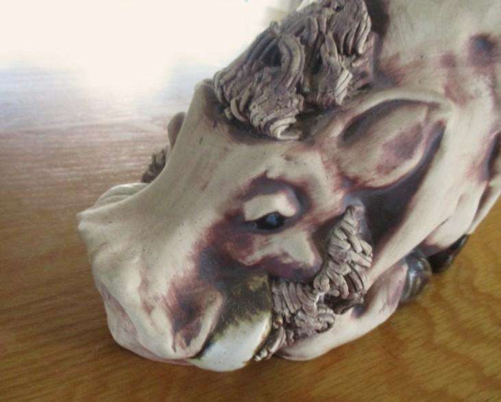 So original! a pair of large ceramic warthog bookends