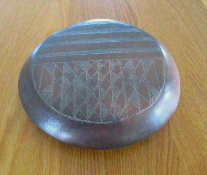 So unique!  African etched baked clay trivet/pot stand