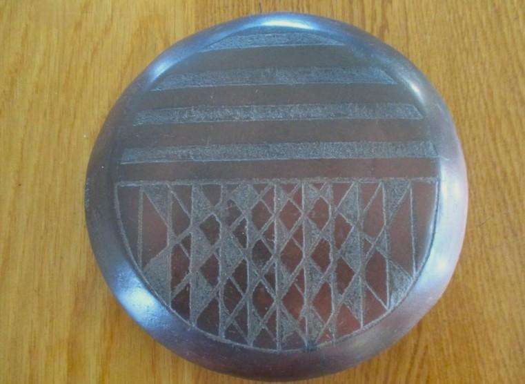 So unique!  African etched baked clay trivet/pot stand