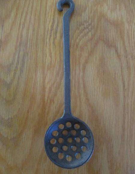 Three vintage solid cast iron ladles