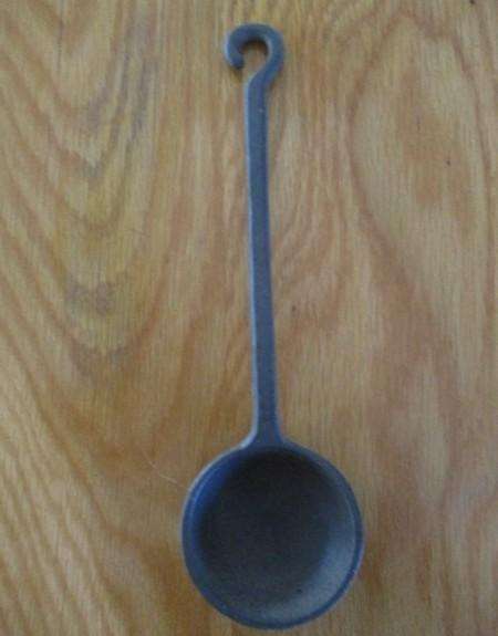 Three vintage solid cast iron ladles