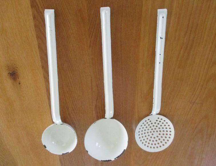 Three long vintage white enamel ladles