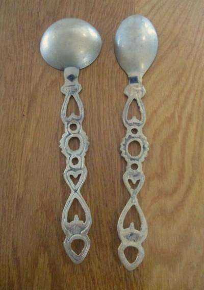 Two ornate Welsh-style solid brass Love Spoons made in India