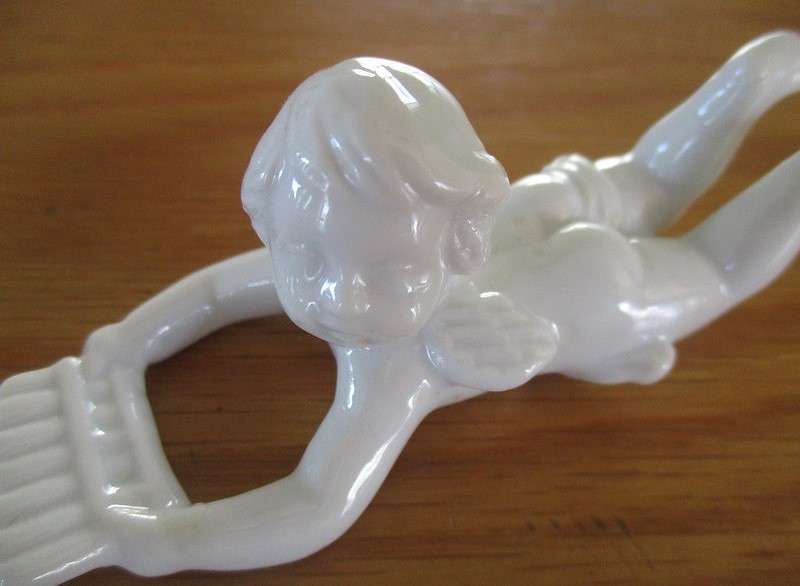 Eight beautiful blanc de chine cherub wall hangers/napkin holders/ornaments