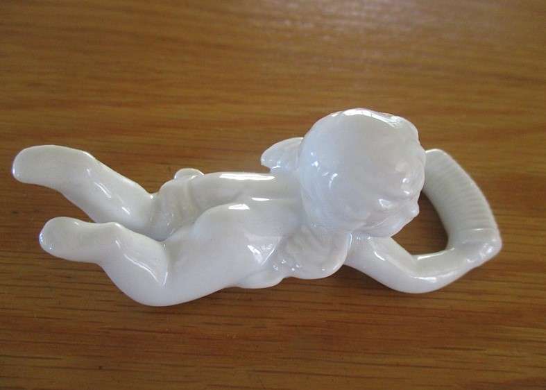Eight beautiful blanc de chine cherub wall hangers/napkin holders/ornaments