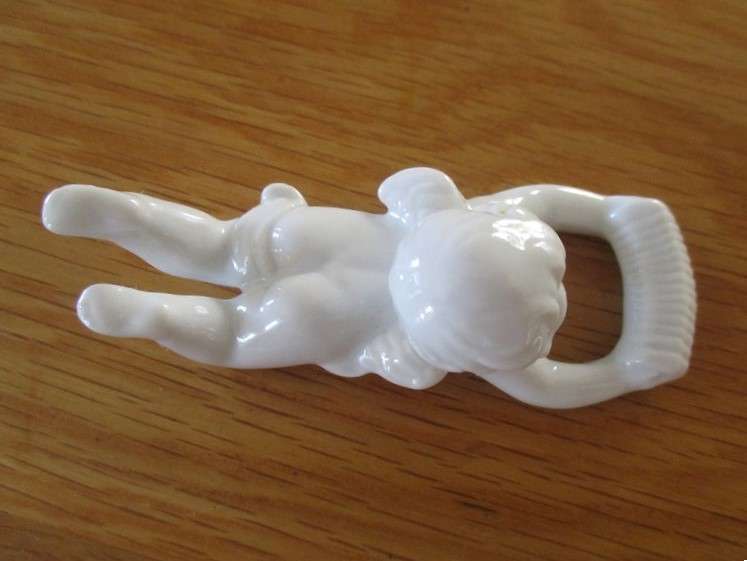 Eight beautiful blanc de chine cherub wall hangers/napkin holders/ornaments