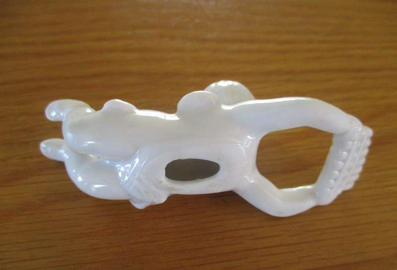Eight beautiful blanc de chine cherub wall hangers/napkin holders/ornaments