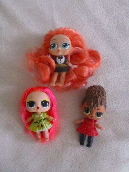 Two adorable small LOL Surprise dollies made by MGA plus one curly-haired friend