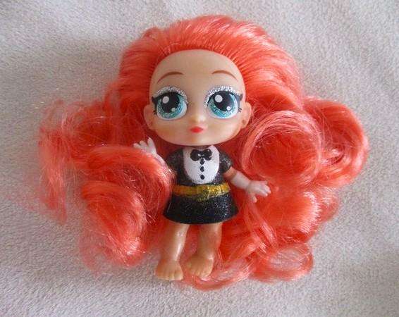 Two adorable small LOL Surprise dollies made by MGA plus one curly-haired friend