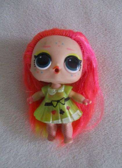 Two adorable small LOL Surprise dollies made by MGA plus one curly-haired friend