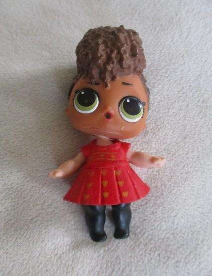 Two adorable small LOL Surprise dollies made by MGA plus one curly-haired friend
