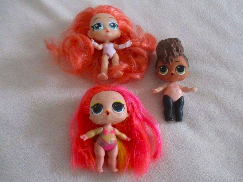 Two adorable small LOL Surprise dollies made by MGA plus one curly-haired friend