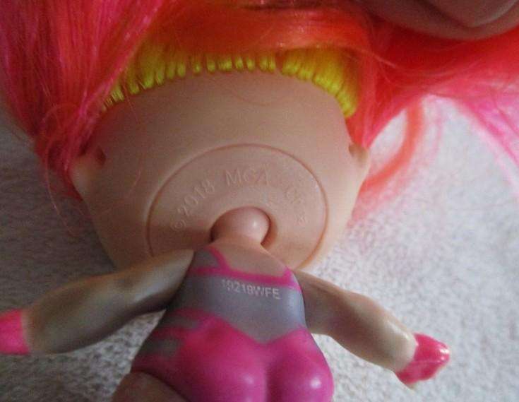 Two adorable small LOL Surprise dollies made by MGA plus one curly-haired friend
