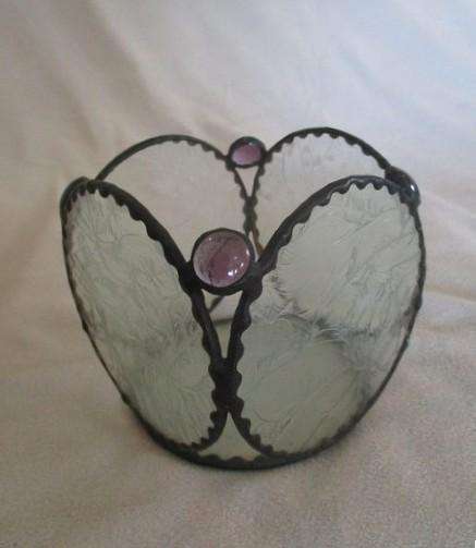 Decorative, nice-sized metal and textured glass candle holder