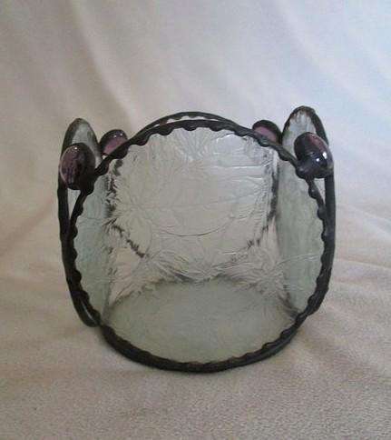 Decorative, nice-sized metal and textured glass candle holder
