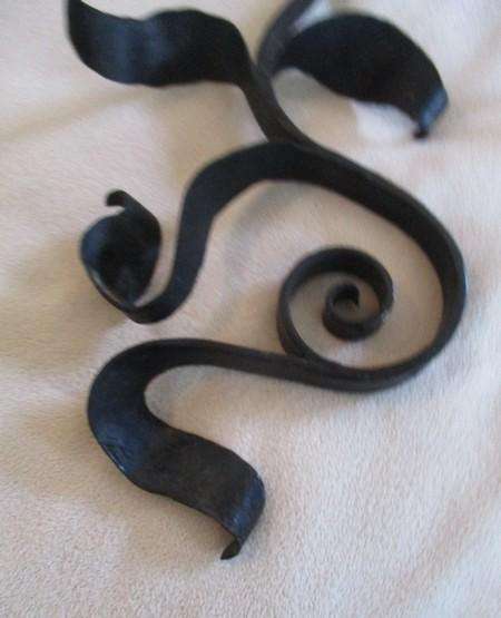 Three vintage black metal wall mount open scroll shaped hanging brackets