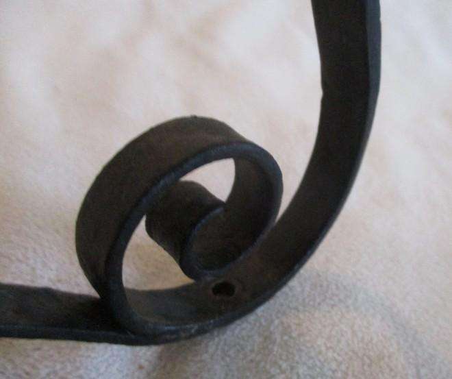 Three vintage black metal wall mount open scroll shaped hanging brackets