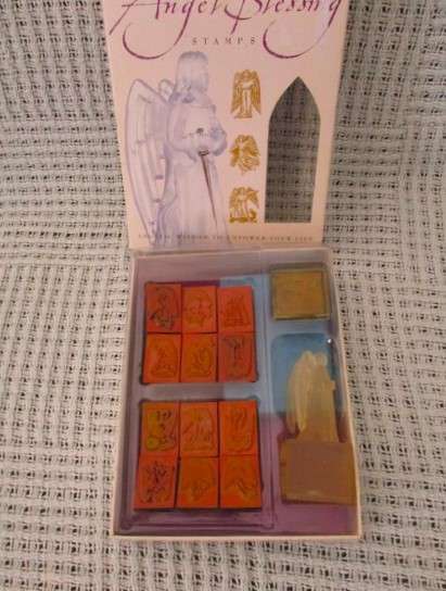 A box of twelve Angel blessing rubber stamps  with Archangel Michael base/applicator