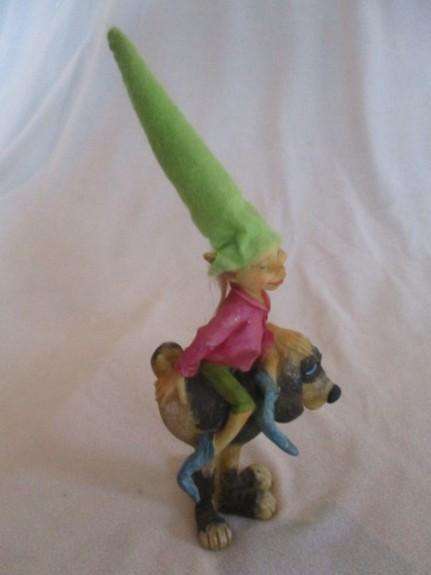 Cute cheeky-faced pixie on his hound