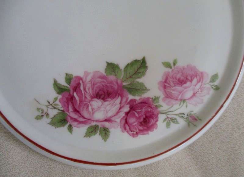 Porcelain teapot stand with pretty pink roses