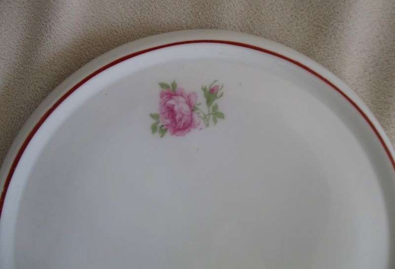 Porcelain teapot stand with pretty pink roses