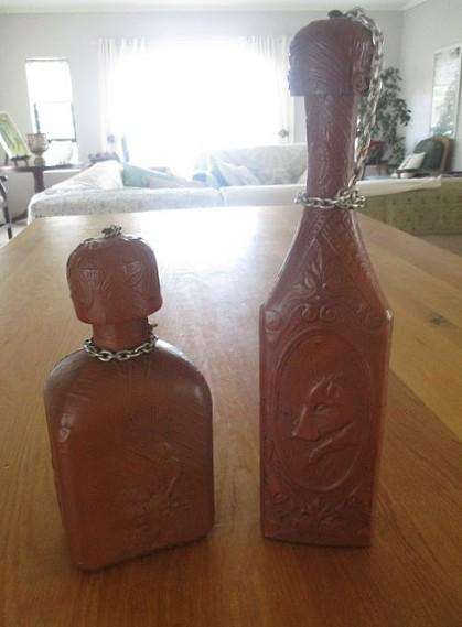 Two beautifully decorative Spanish hand made leather embossed decanters