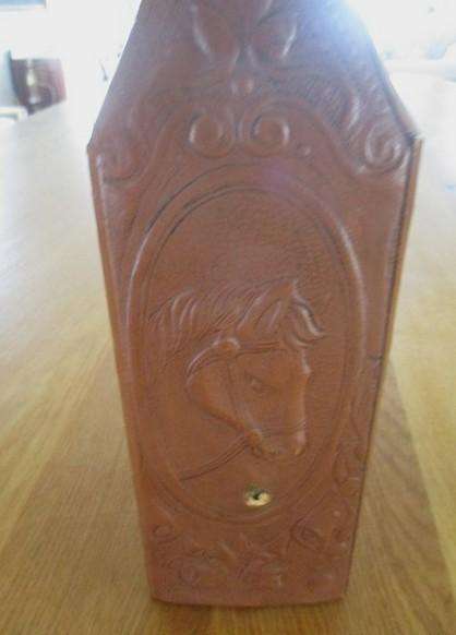 Two beautifully decorative Spanish hand made leather embossed decanters