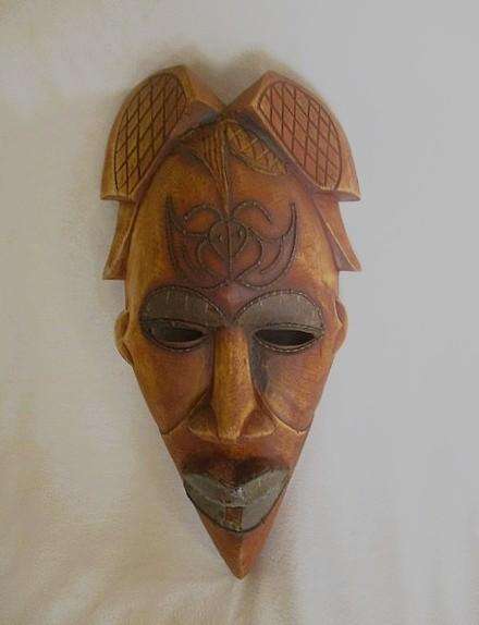 Large vintage hand carved wooden mask from Gabon with inlaid metal decorative detail