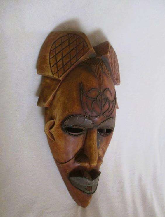 Large vintage hand carved wooden mask from Gabon with inlaid metal decorative detail