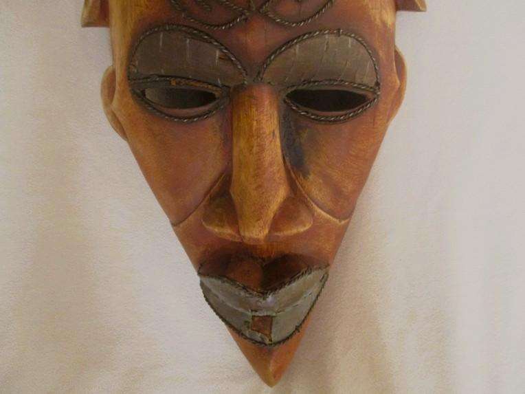 Large vintage hand carved wooden mask from Gabon with inlaid metal decorative detail