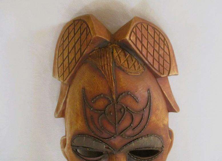Large vintage hand carved wooden mask from Gabon with inlaid metal decorative detail