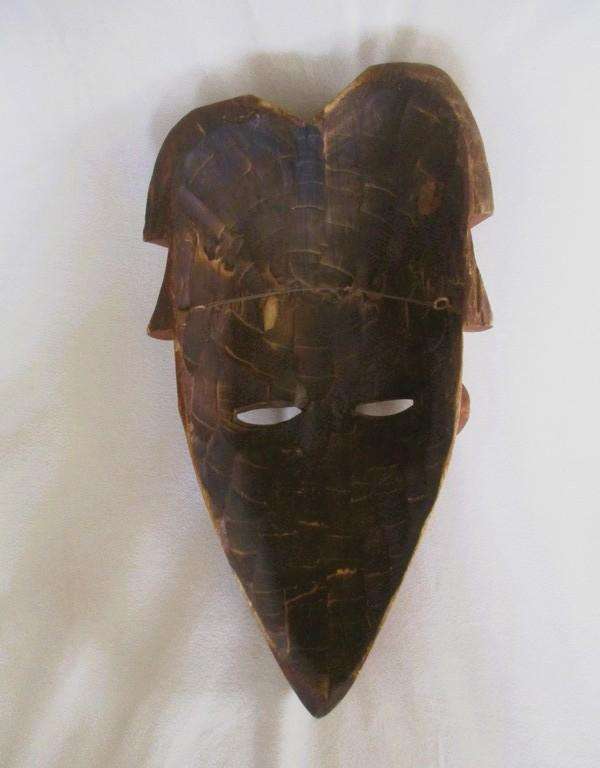 Large vintage hand carved wooden mask from Gabon with inlaid metal decorative detail