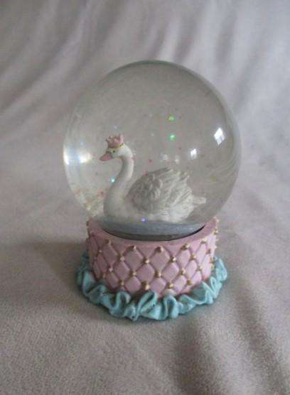 Glass Swan snow ball with pretty glittery "snow flakes"