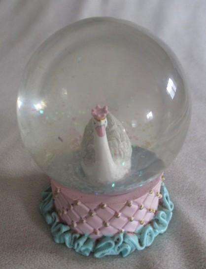 Glass Swan snow ball with pretty glittery "snow flakes"
