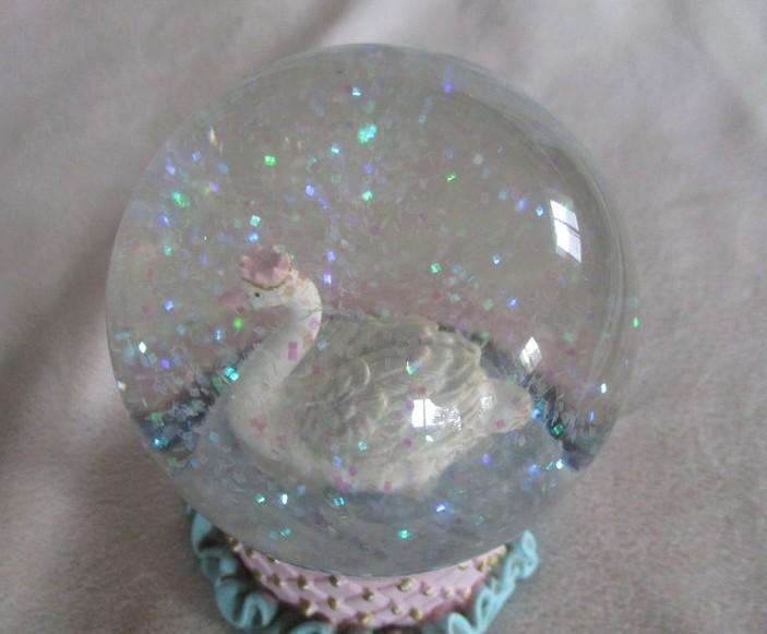 Glass Swan snow ball with pretty glittery "snow flakes"