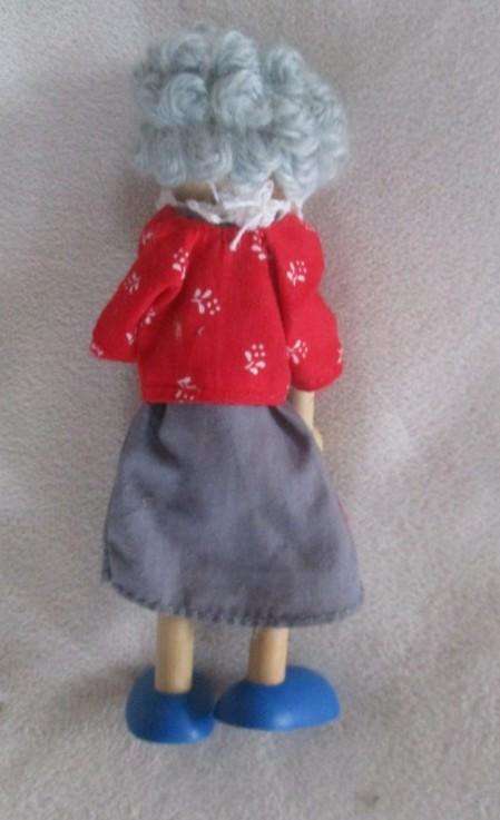Three adorable, poseable wooden dollies