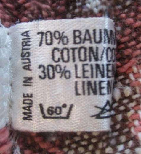 Small woven Austrian cloth with traditional Austrian figures and crocheted border
