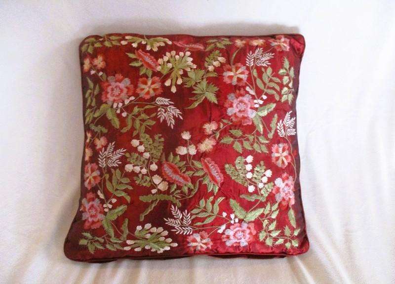 Stunning copiously embroidered ruby red cushion with floral design