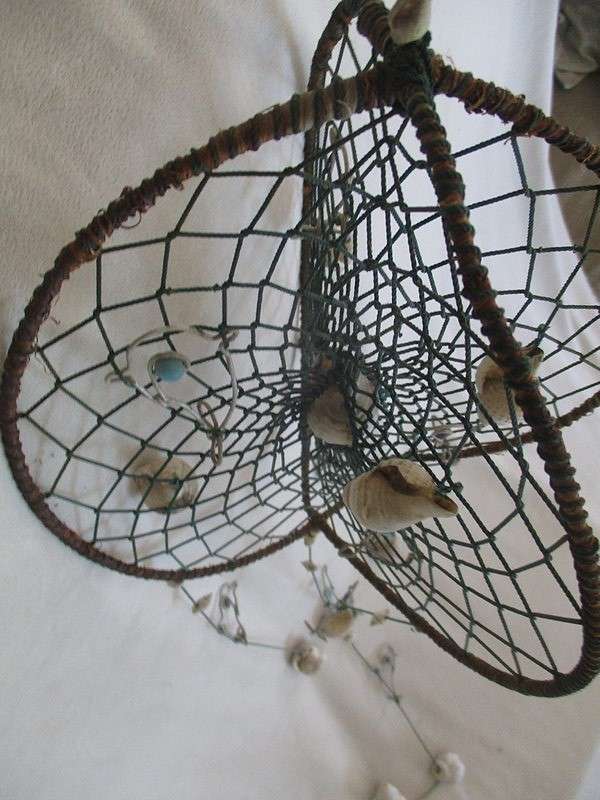 A breezy and decorative seashell and string hanger