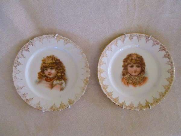 2. Two vintage porcelain display plates of two Victorian young girls -  with hangers